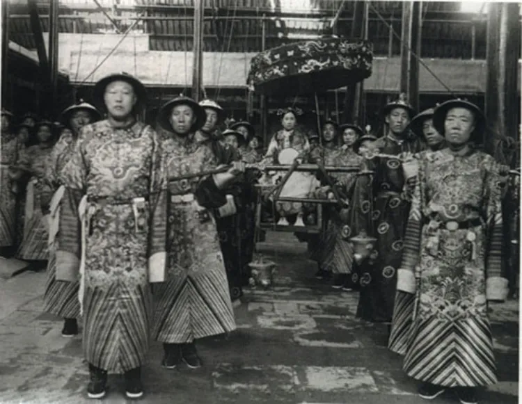 Empress Dowager Cixi carried in a palanquin by chief eunuchs Li Lianying and Cui Yugui 1903