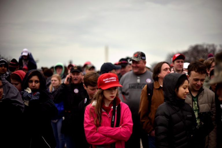 The crowd on the National Mall reacts during the inauguration of U.S. President Donald Trump in Washington