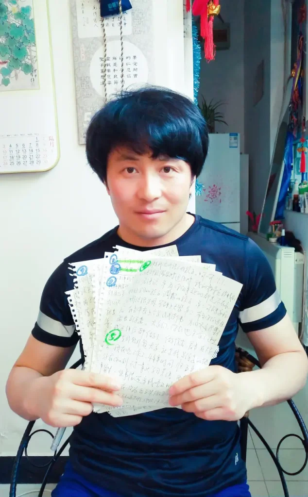 Jackie shows his notes about his life while we are working on our book
